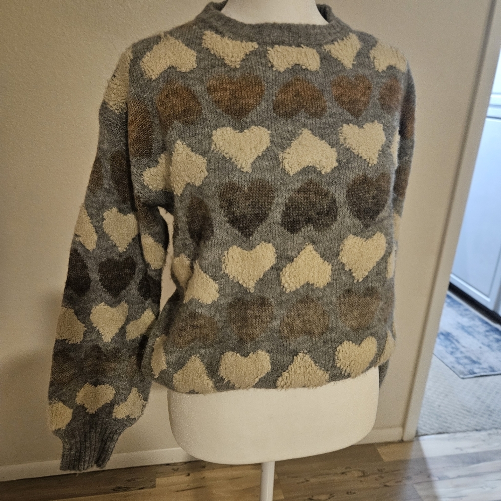 Chunky sweater with raised hearts.